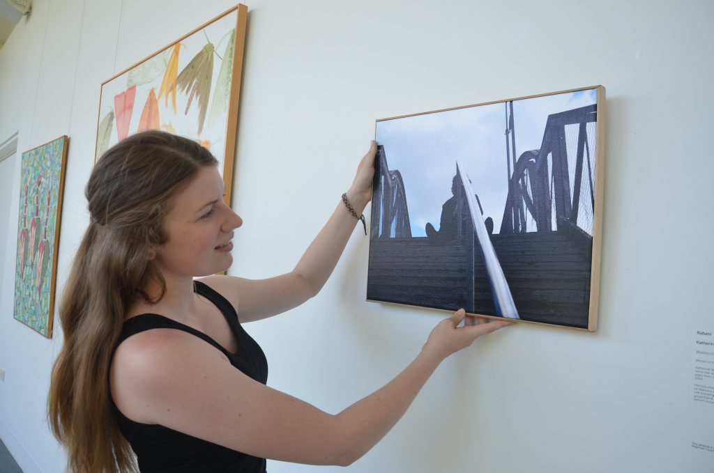 Ceilidh Bishop prepares her Warwick Art Gallery exhibit for the official opening on Thursday. 